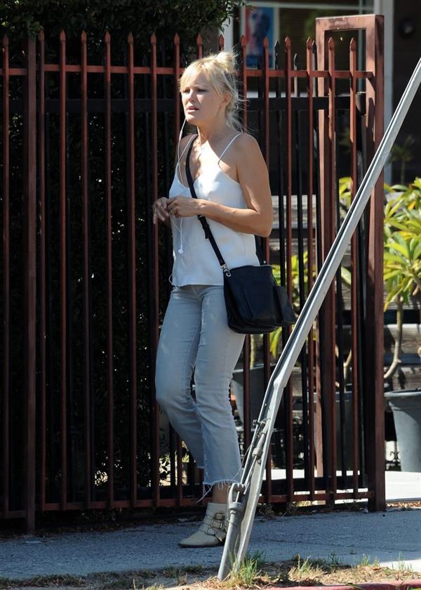 Malin Akerman braless tits showing off her boobs in a blouse top seen by paparazzi.












