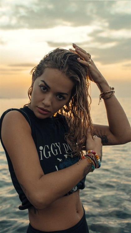 Rita Ora Pictures Rita Ora braless boobs in a wet t-shirt showing off her tits.