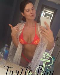 Amanda Cerny in a bikini taking a selfie