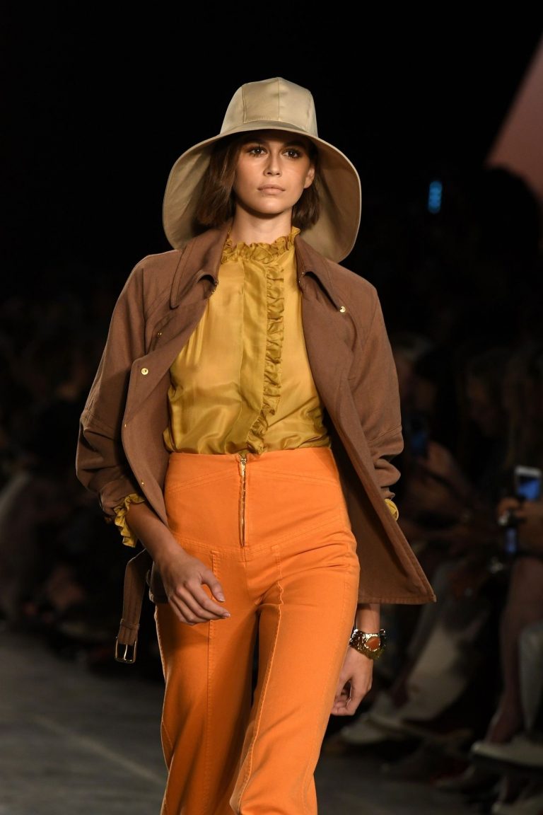 Kaia Gerber Pictures Kaia Gerber braless boobs in a see through top showing off her tits modelling on the runway.