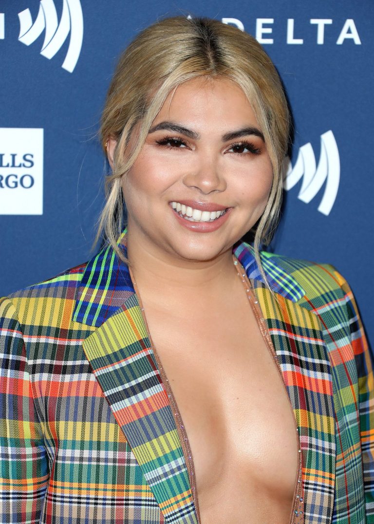 Hayley Kiyoko braless boobs showing nice cleavage in a low cut open top.




















