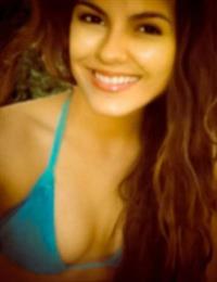 Victoria Justice in a bikini taking a selfie