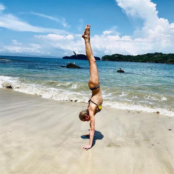 Katie Cassidy sexy bikini photos on the beach doing a handstand.













































