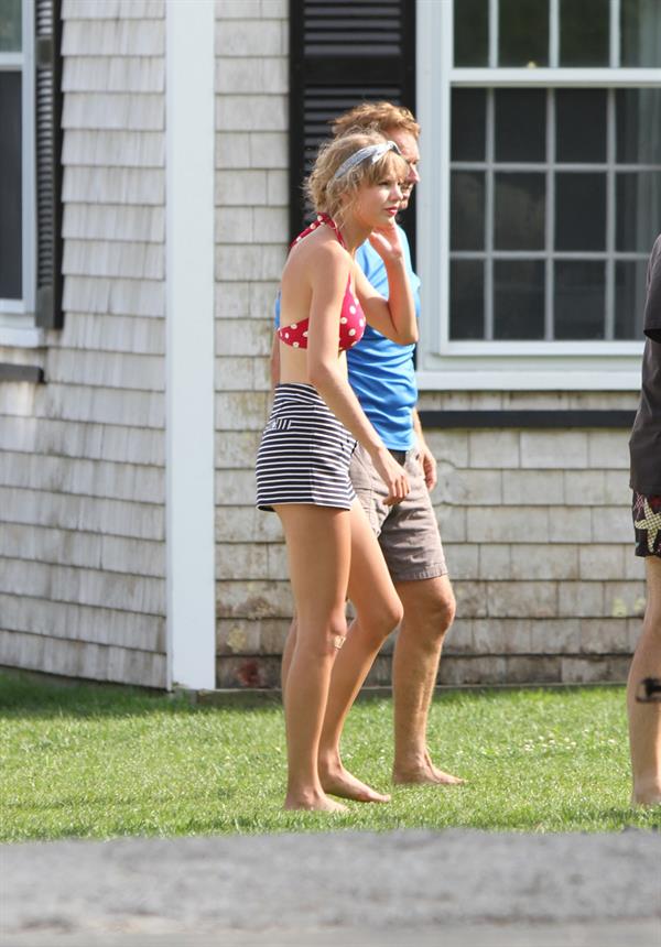 Taylor Swift wearing a bikini top and swimsuit in Hyannis on April 12, 2013