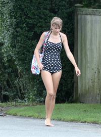 Taylor Swift wearing a bikini top and swimsuit in Hyannis on April 12, 2013