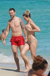 Aferdita Dreshaj in a bikini with her big boobs showing nice cleavage and sexy ass seen by paparazzi at the beach with Jakub Kindl.






























