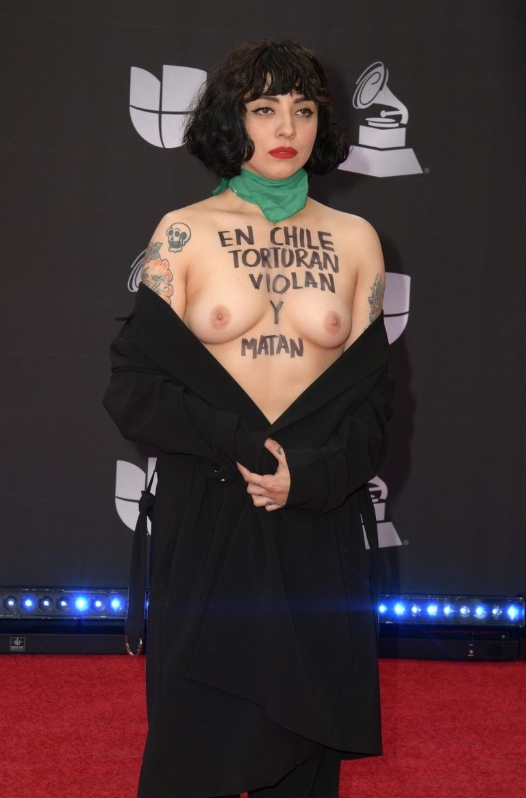 Mon Laferte nude boobs on the red carpet at the Latin Grammy Awards going  topless. . Rating = 5.08/10