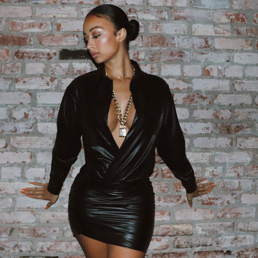 Draya Michele Pictures Draya Michele braless boobs showing nice cleavage in a sexy little low cut minidress.