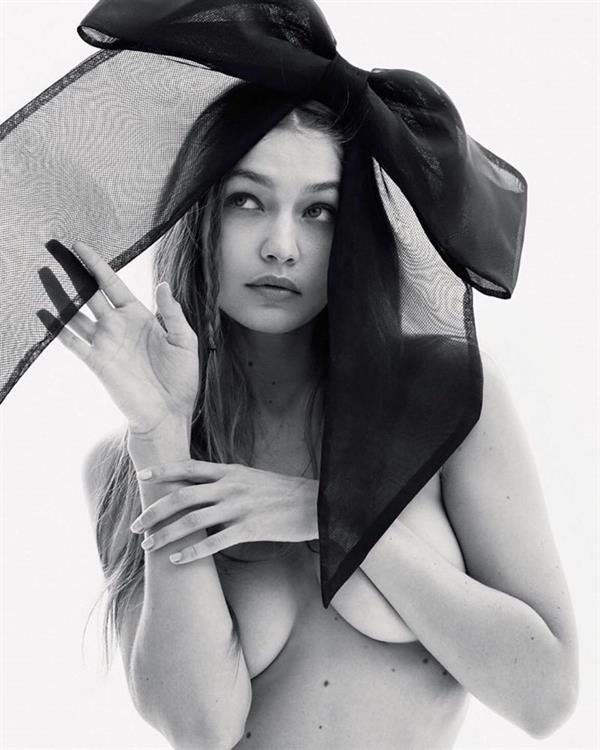 Gigi Hadid nude and sexy photoshoot for Russian Vogue holding her topless boobs showing off her model body.