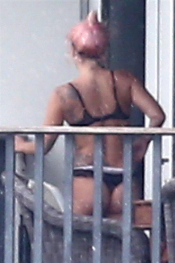 Lady Gaga caught in her underwear showing her sexy ass in thong panties seen on a balcony by paparazzi.