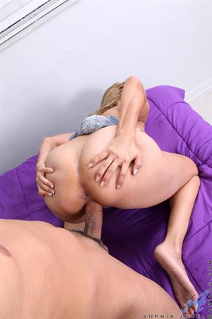 Sophia Jewel is an all American babe with a set of jugs that no man can keep his hands off of! When Sophia lures her man into a nearby bedroom and entices him with a long sexy blowjob, it's not surprising that the next step is spectacular sex! The lovers switch through a variety of positions, enjoying a lazy afternoon of raunchy fucking. 