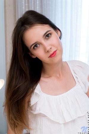 Trasy Nude Pictures Like most teen girls, Trasy loves sweets. Peeling off her panties, she tweaks her puffy nips to hard peaks and then slides her talented fingers all the way into her tight little fuck hole to masturbate. Licking her fingers clean as she goes, she enjoys the sweetness of her homemade pussy juices.