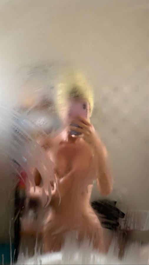 Mathilde Tantot naked getting out of the shower shared a couple new photos holding her topless boobs, showing her nude ass, and the mirror fog covering her pussy.