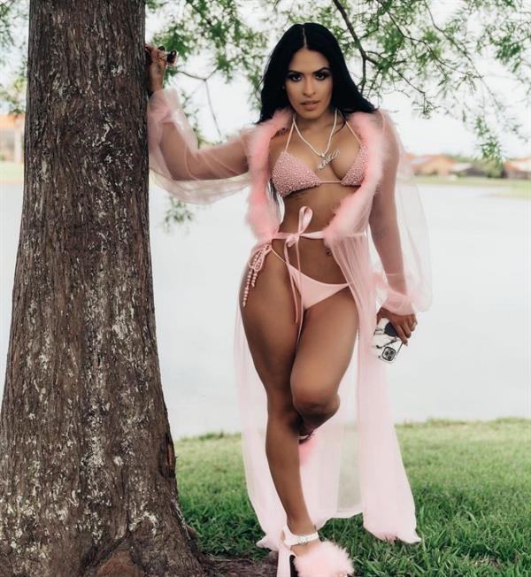 WWE Zelina Vega also known as Thea Megan Trinidad new photoshoot in a sexy little pink bikini showing nice cleavage with her big tits.