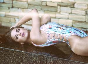 Dessie Mitcheson in a sexy and funky print, one piece swimsuit