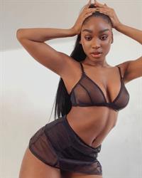 Normani boobs showing off her big tits and nice cleavage in a see through bra posing for the Savage X Fenty line.