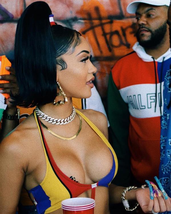 Saweetie boobs showing nice cleavage and a bit of a wardrobe malfunction showing her big tits with pasties on them in a sexy little dress.