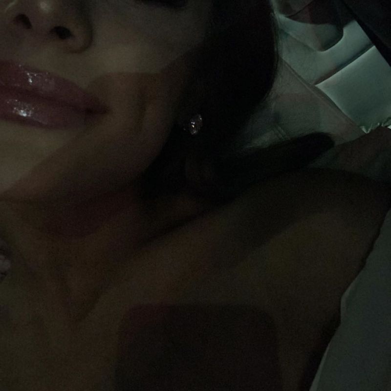 Ariana Grande Pictures Ariana Grande topless covered new photo laying down showing off her sexy lips with gloss.