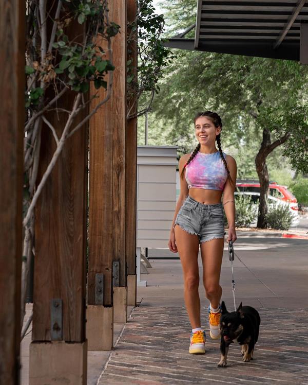 Violet Summers walking her little doggy