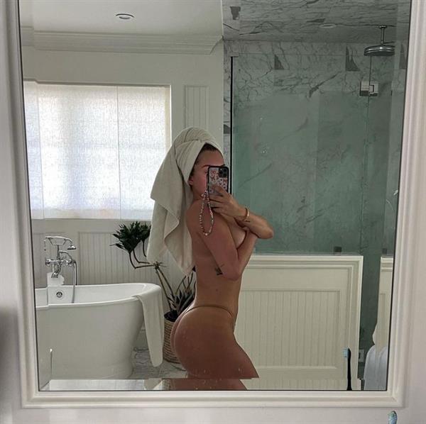 Anastasia Karanikolaou aka Stassie nude boobs new photo in her bathroom holding her topless big tits in just thong panties.