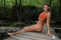 Melena Maria Rya relaxing at the waterfall