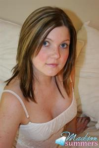 Madison Summers strips down on a white bed