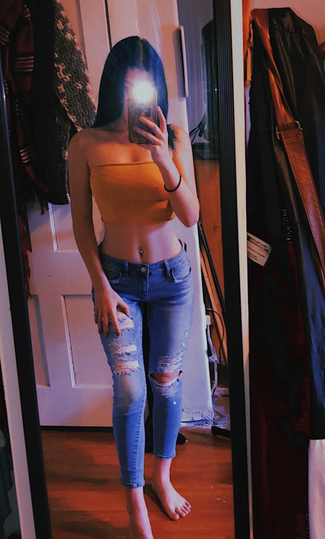 Tabby in a bikini taking a selfie