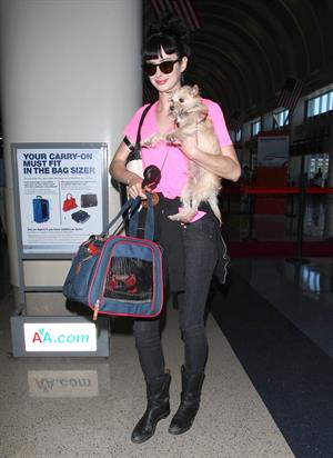 Krysten Ritter - Prepares to leave LAX in Los Angeles, California - June 8, 2012 