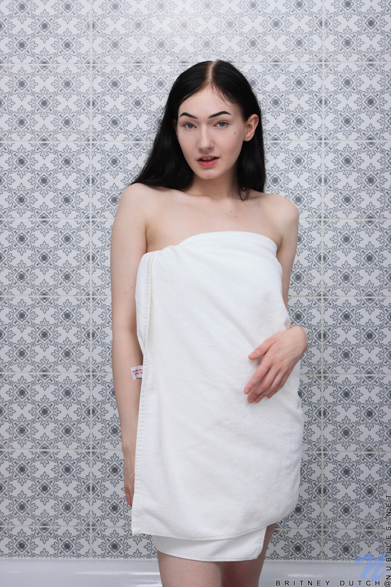 Britney Dutch looks in a mirror as she applies her makeup but the horny bombshell doesn't get past that in terms of dressing before she decides to masturbate instead.