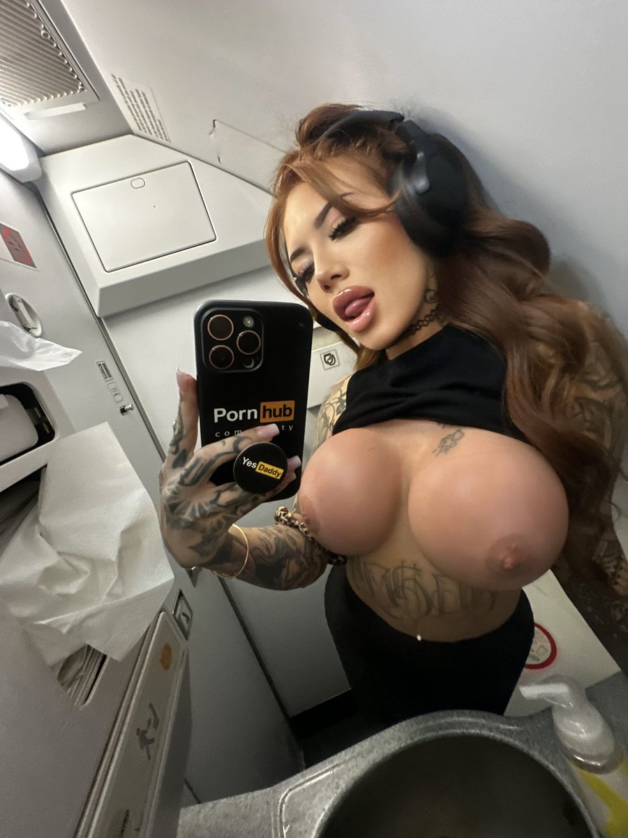 Lacey Jayne taking a selfie and - breasts