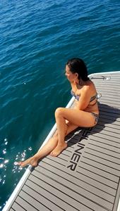 Stercy sunbathing on the yacht