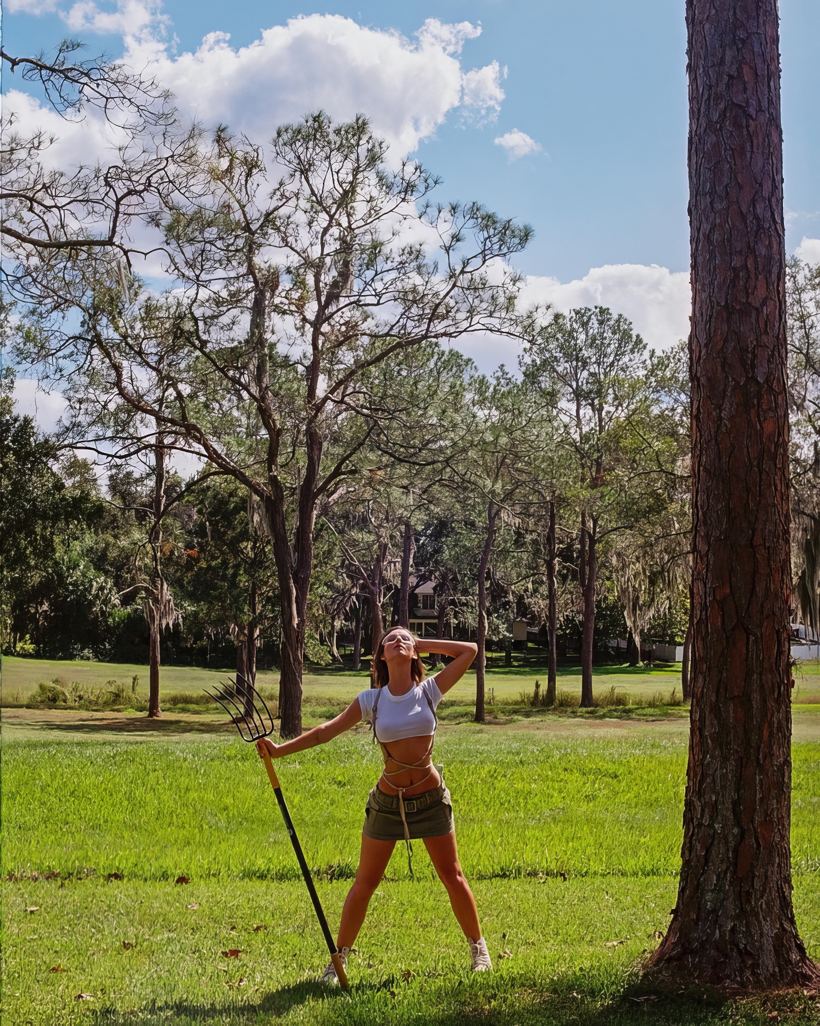 Posing with a pitchfork