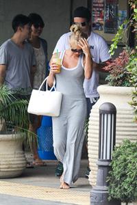 Pamela Anderson leaves barefoot a local Restaurant with a friend in Malibu July 6, 2013 